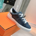Hermes H232176Z 90350 Brown & White Sneakers – Iconic Design and Premium Craftsmanship Hermes Mens Sneaker H232176Z 90350 in Brown and White – Front View of Luxury Sneakers with Contrasting Stripes