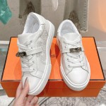 Hermes H232176Z 90350 White Sneakers – Iconic Perforated Design and Premium Craftsmanship Hermes Mens Sneaker H232176Z 90350 in White – Front View of Luxurious All-White Sneakers with Iconic Perforations