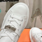 Hermes H232176Z 90350 White Sneakers – Iconic Perforated Design and Premium Craftsmanship Hermes Mens Sneaker H232176Z 90350 in White – Front View of Luxurious All-White Sneakers with Iconic Perforations