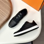 Hermes H242933Z H69440 White & Blue Sneakers – Side Detail of Iconic Stripes Hermes Mens Sneaker H242933Z H69440 in White and Blue – Front View of Luxury Sneakers with Navy Blue Stripes