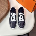 Hermes H242933Z H69440 White & Blue Sneakers – Side Detail of Iconic Stripes Hermes Mens Sneaker H242933Z H69440 in White and Blue – Front View of Luxury Sneakers with Navy Blue Stripes
