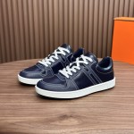 Hermes H242933Z H69440 White & Blue Sneakers – Side Detail of Iconic Stripes Hermes Mens Sneaker H242933Z H69440 in White and Blue – Front View of Luxury Sneakers with Navy Blue Stripes