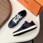 Hermes H242933Z H69440 White & Blue Sneakers – Side Detail of Iconic Stripes Hermes Mens Sneaker H242933Z H69440 in White and Blue – Front View of Luxury Sneakers with Navy Blue Stripes