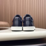 Hermes H242933Z H69440 White & Blue Sneakers – Side Detail of Iconic Stripes Hermes Mens Sneaker H242933Z H69440 in White and Blue – Front View of Luxury Sneakers with Navy Blue Stripes