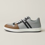 Hermes H242933Z H69440 Grey & Brown Sneakers – Side Detail of Stripes Hermes Mens Sneaker H242933Z H69440 in Grey and Brown – Front View of Luxury Sneakers with Iconic Leather Stripes