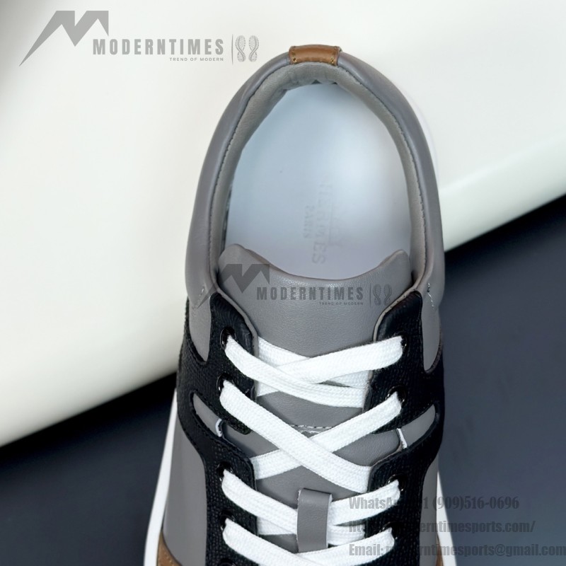 Hermes H242933Z H69440 Grey & Brown Sneakers – Side Detail of Stripes Hermes Mens Sneaker H242933Z H69440 in Grey and Brown – Front View of Luxury Sneakers with Iconic Leather Stripes