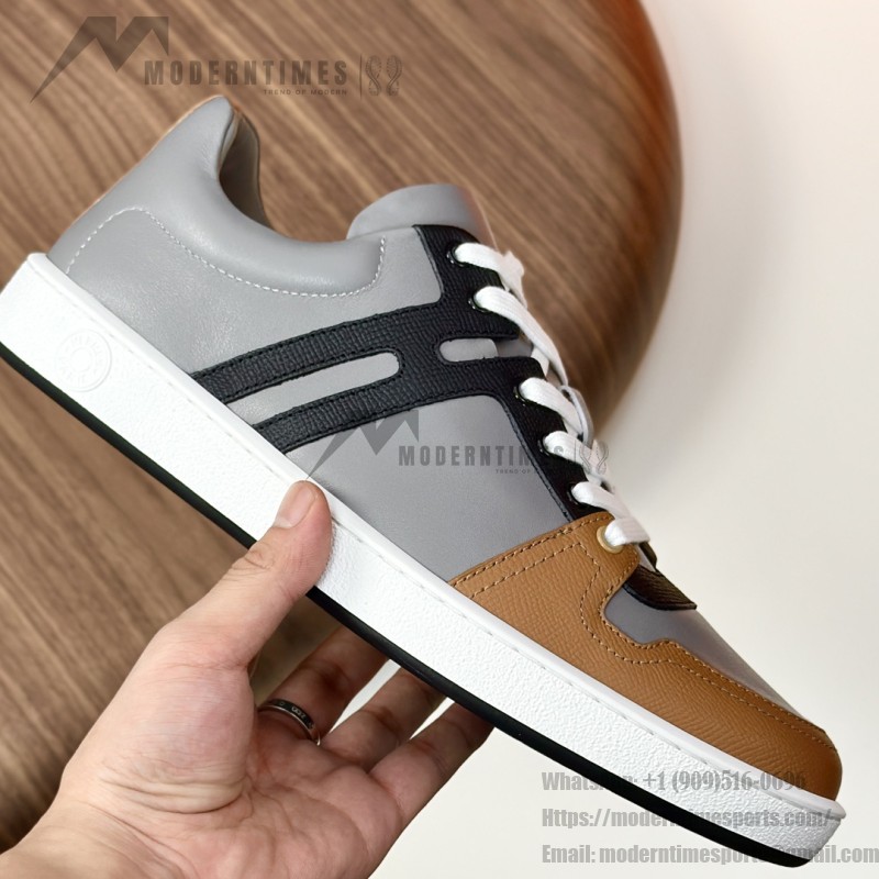 Hermes H242933Z H69440 Grey & Brown Sneakers – Side Detail of Stripes Hermes Mens Sneaker H242933Z H69440 in Grey and Brown – Front View of Luxury Sneakers with Iconic Leather Stripes