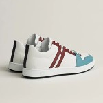 Hermes H242933Z H69440 White & Blue Sneakers – Side Detail of Iconic Stripes Hermes Mens Sneaker H242933Z H69440 in White and Blue – Front View of Luxury Sneakers with Navy Blue Stripes