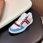 Hermes H242933Z H69440 White & Blue Sneakers – Side Detail of Iconic Stripes Hermes Mens Sneaker H242933Z H69440 in White and Blue – Front View of Luxury Sneakers with Navy Blue Stripes