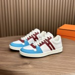 Hermes H242933Z H69440 White & Blue Sneakers – Side Detail of Iconic Stripes Hermes Mens Sneaker H242933Z H69440 in White and Blue – Front View of Luxury Sneakers with Navy Blue Stripes