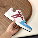 Hermes H242933Z H69440 White & Blue Sneakers – Side Detail of Iconic Stripes Hermes Mens Sneaker H242933Z H69440 in White and Blue – Front View of Luxury Sneakers with Navy Blue Stripes