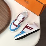 Hermes H242933Z H69440 White & Blue Sneakers – Side Detail of Iconic Stripes Hermes Mens Sneaker H242933Z H69440 in White and Blue – Front View of Luxury Sneakers with Navy Blue Stripes