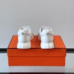 Hermes H251121Z 02360 White Sneakers – Iconic H Logo on Heel Hermes Mens Sneaker H251121Z 02360 in White – Front View of Luxury Fashion Sneakers with Orange H Logo