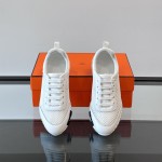 Hermes H251121Z 02360 White Sneakers – Iconic H Logo on Heel Hermes Mens Sneaker H251121Z 02360 in White – Front View of Luxury Fashion Sneakers with Orange H Logo