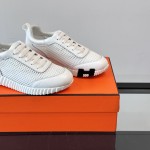 Hermes H251121Z 02360 White Sneakers – Iconic H Logo on Heel Hermes Mens Sneaker H251121Z 02360 in White – Front View of Luxury Fashion Sneakers with Orange H Logo