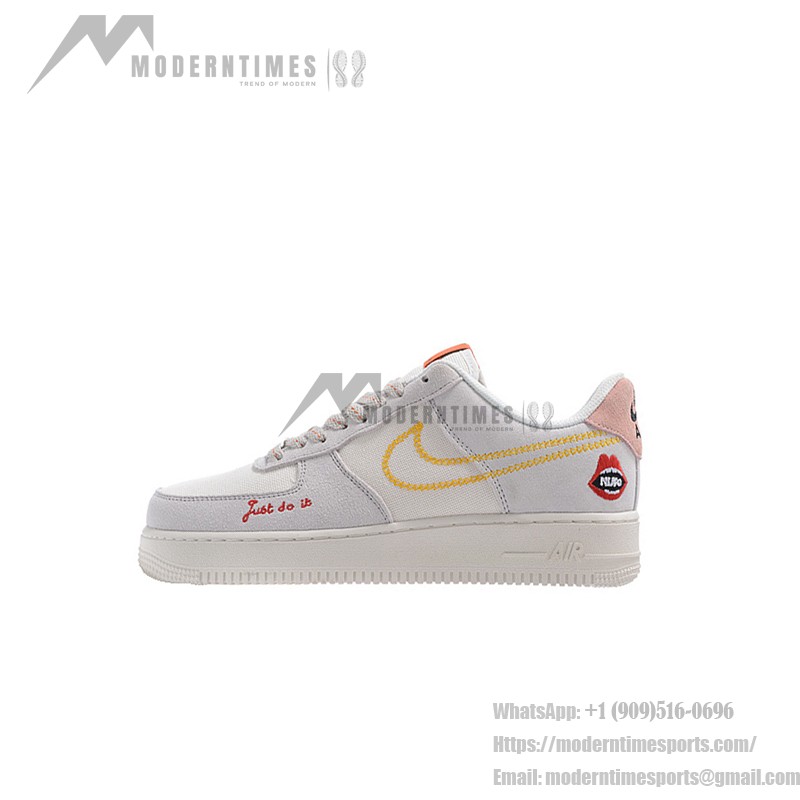 Nike Air Force 1 Low WMNS "Just Do It" sneakers in beige with yellow stitching and graphic details