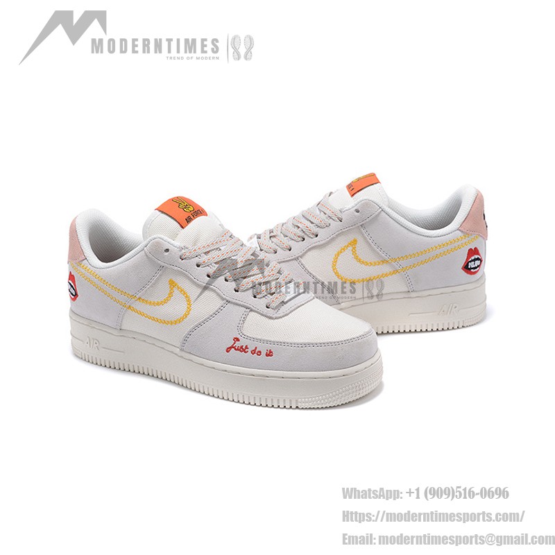 Nike Air Force 1 Low WMNS "Just Do It" sneakers in beige with yellow stitching and graphic details