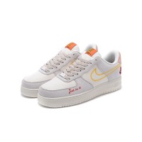 Nike Air Force 1 Low WMNS "Just Do It" DQ7656-100 - Beige Sneakers with Yellow Stitching and Fun Graphic Details for Women