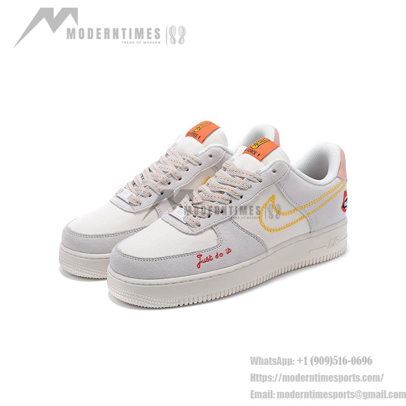 Nike Air Force 1 Low WMNS "Just Do It" sneakers in beige with yellow stitching and graphic details