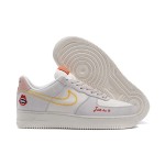 Nike Air Force 1 Low WMNS "Just Do It" sneakers in beige with yellow stitching and graphic details