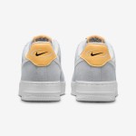 Nike Air Force 1 Low WMNS "Pure Platinum" sneakers in white and gray with yellow accents