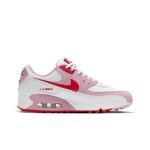 White Nike Air Max 90 Valentine's Day sneakers with pink overlays and red swoosh.