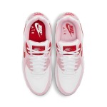 White Nike Air Max 90 Valentine's Day sneakers with pink overlays and red swoosh.