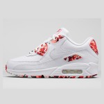 Close-up of Nike Air Max 90 813150-100 with red camouflage overlays and white leather upper