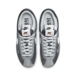 Sacai x Nike Cortez 4.0 Iron Grey DQ0581-001 - Modern grey sneakers with layered design and Zoom Air cushioning