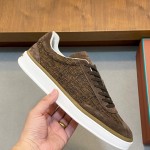 Loro Piana dark brown low-top sneaker with woven textile upper, tonal suede panels, khaki-brown trim and white rubber sole