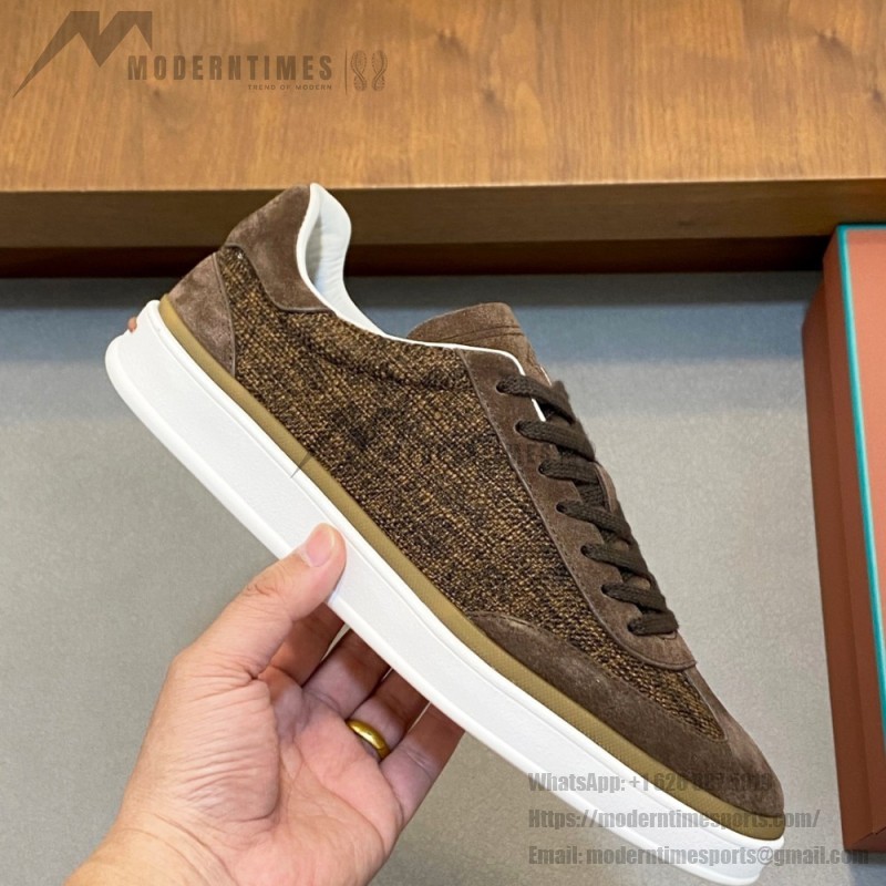 Loro Piana dark brown low-top sneaker with woven textile upper, tonal suede panels, khaki-brown trim and white rubber sole