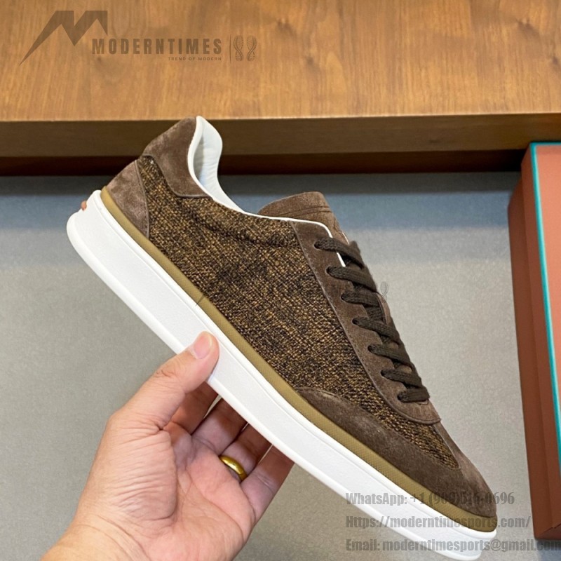 Loro Piana dark brown low-top sneaker with woven textile upper, tonal suede panels, khaki-brown trim and white rubber sole