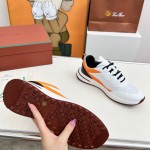 Loro Piana FAM1718-1000 White Leather Sneakers Loro Piana FAM1718-1000 White Sneakers Front View with Red Detailing